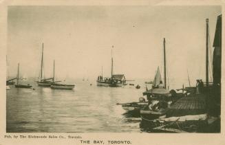 Black and white photo postcard depicting the harbour at the Toronto Canoe Club with boats and c ...