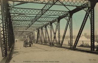 Colour photo postcard depicting the inside of the Union station bridge with a horse-drawn carri ...