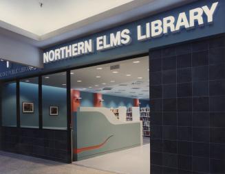 Picture of front of a library branch inside a mall. 