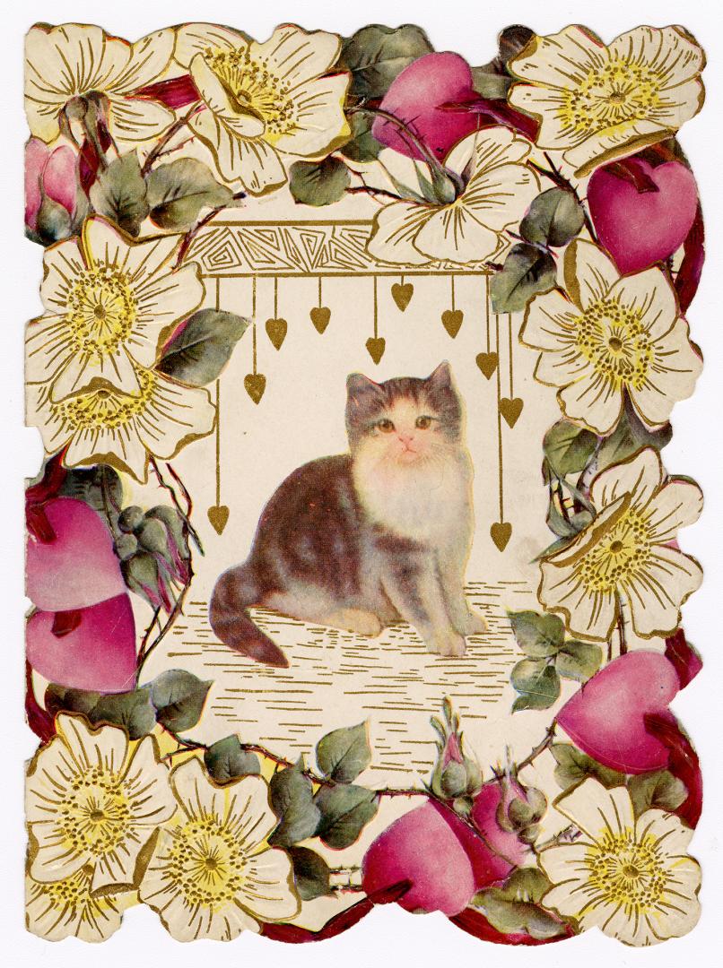 A kitten sits in the centre of the card with small gold hearts hanging above it. It is surround ...