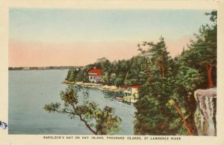 Colorized photograph of a view of a waterway, with summer homes on the river bank.