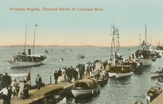 Colorized photograph of crowds of people and sail boats on and beside a wooden dock in a body o ...