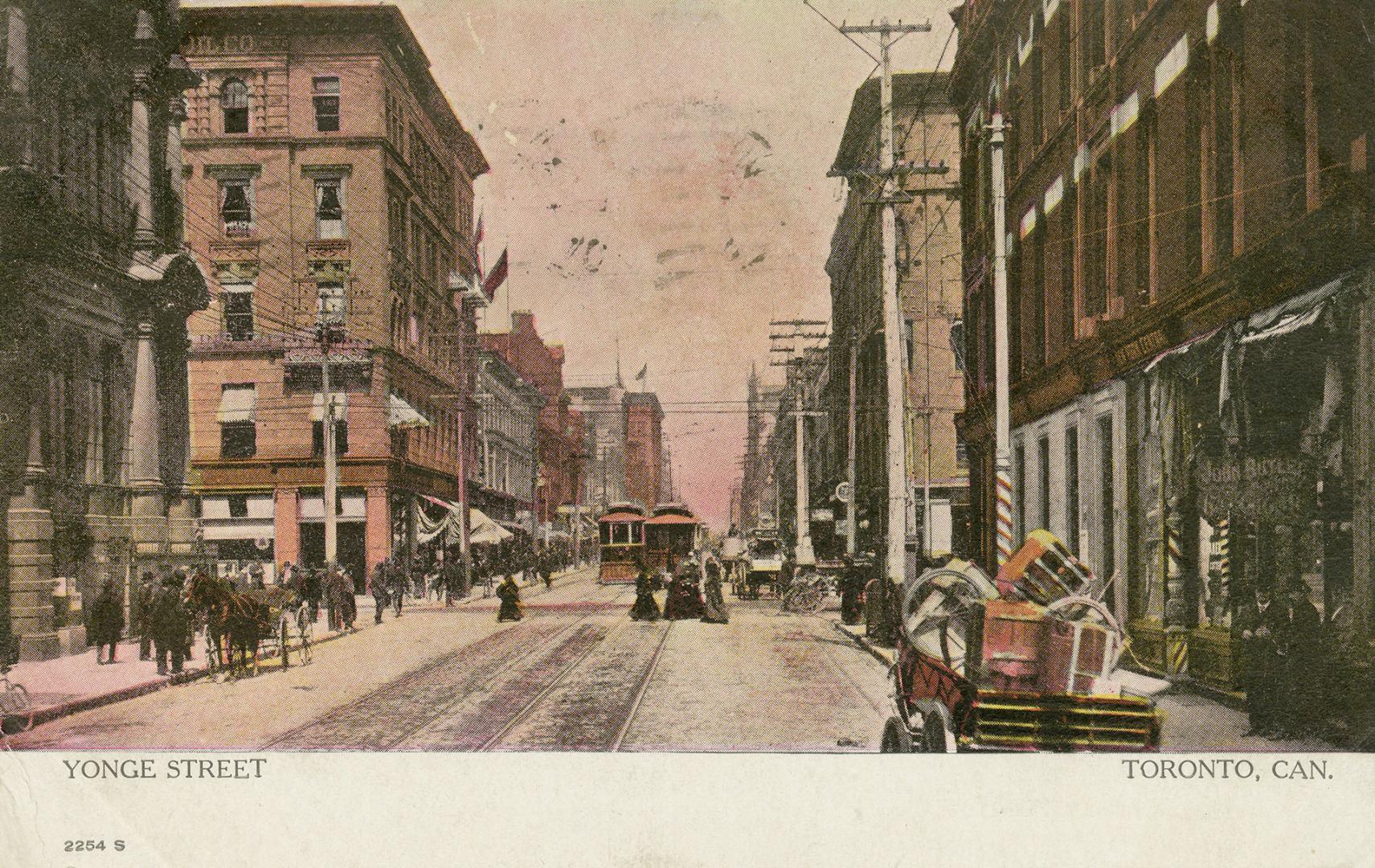 Colour photo postcard with a pink hue, depicting a view of Yonge Street looking north from sout ...