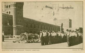 Sepia toned photograph of men in civilian clothes lined up in front of a canon which is in fron ...