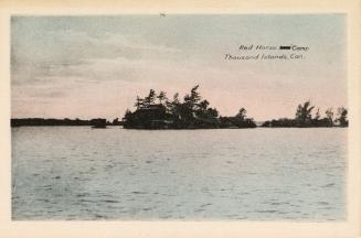 Colorized photograph of an island in the middle of a body of water,