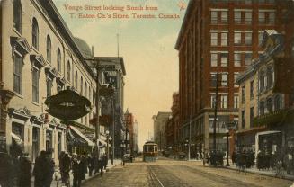 Colour postcard depicting a view of Yonge Street with a streetcar, many shops, and pedestrians  ...