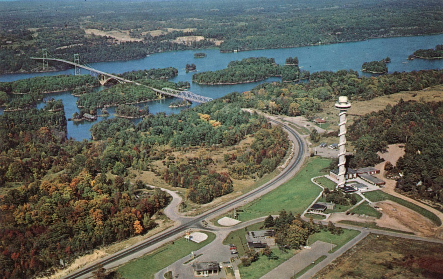 Color aerial photograph of a bridge spanning a river over many islands.