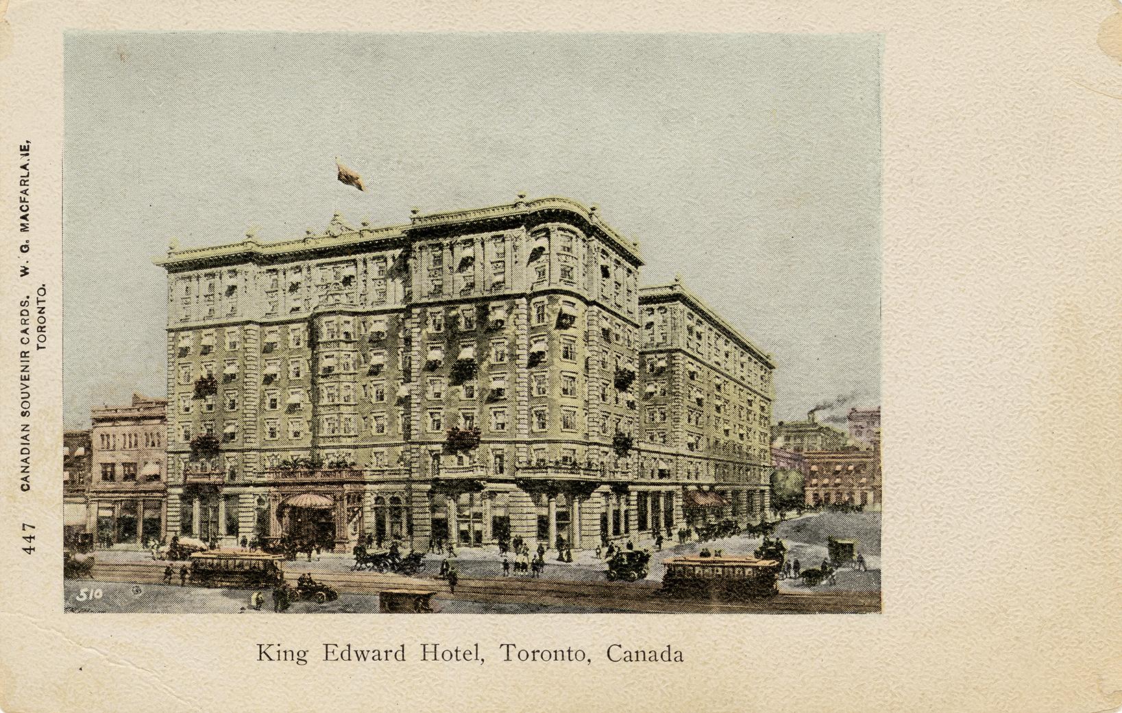 Black and white photograph of a large, multi story public building.