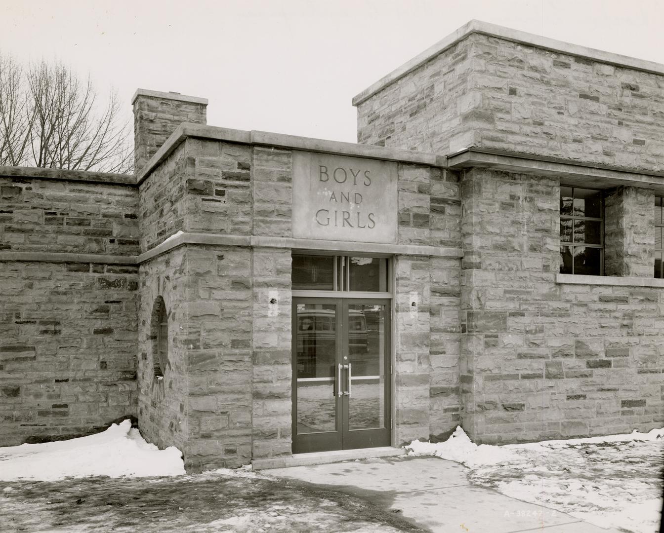 Picture of front doors of one storey library building. 