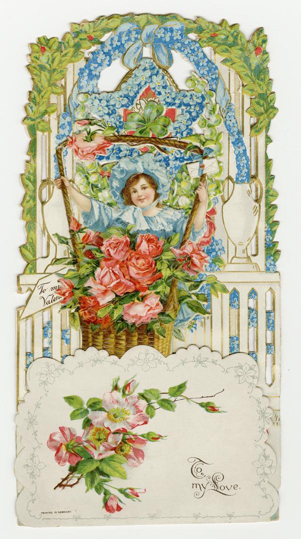 A pop-up card with three layers.Foreground: A girl with a large basket of roses.Midground: A de ...