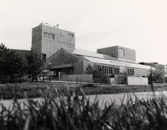 Picture of concrete library building from front entrance. 