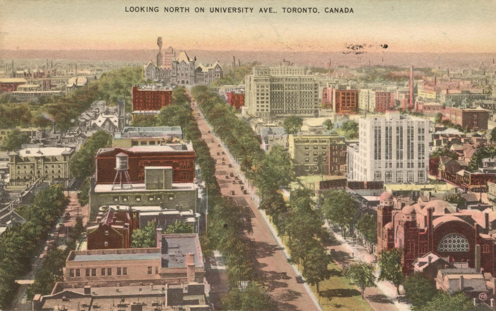 Colorized aerial photograph of a wide, city street.