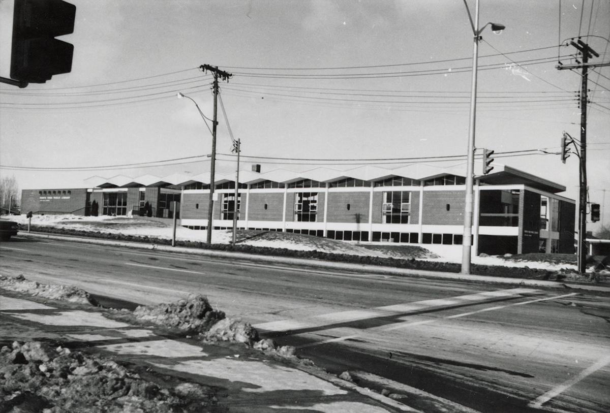 Picture of a library building and wide street in front. 