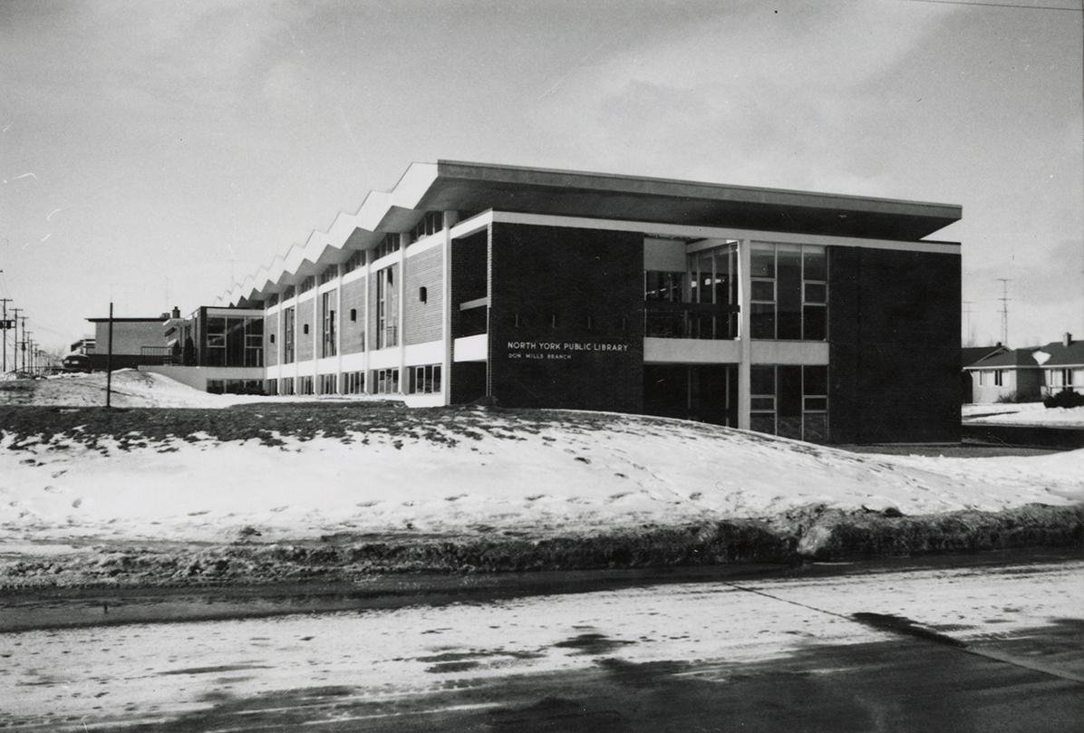 Picture of a library building and snow covered grounds. 