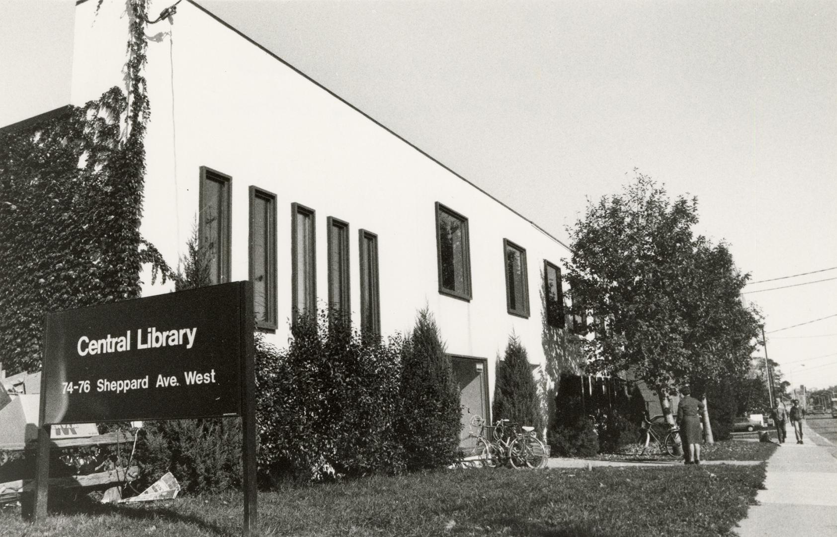 Picture of two storey building with sign on left reading Central Library. 