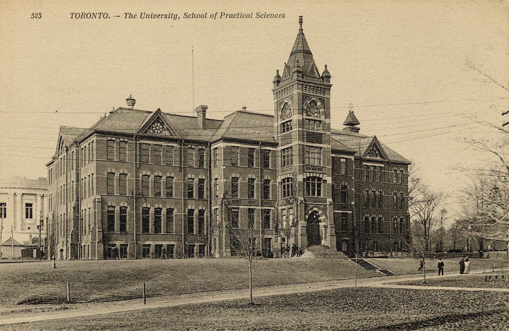 Black and white photo postcard (now sepia-toned) depicting the rear entrance of a large buildin ...