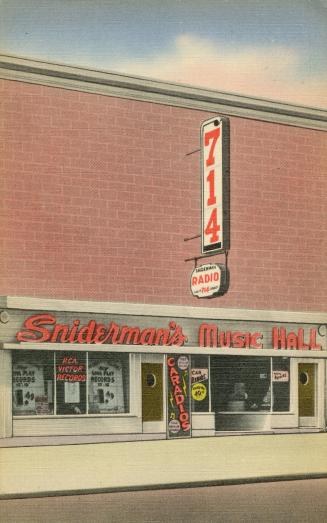 Colorized photograph of the exterior of a store in a long, brick building.