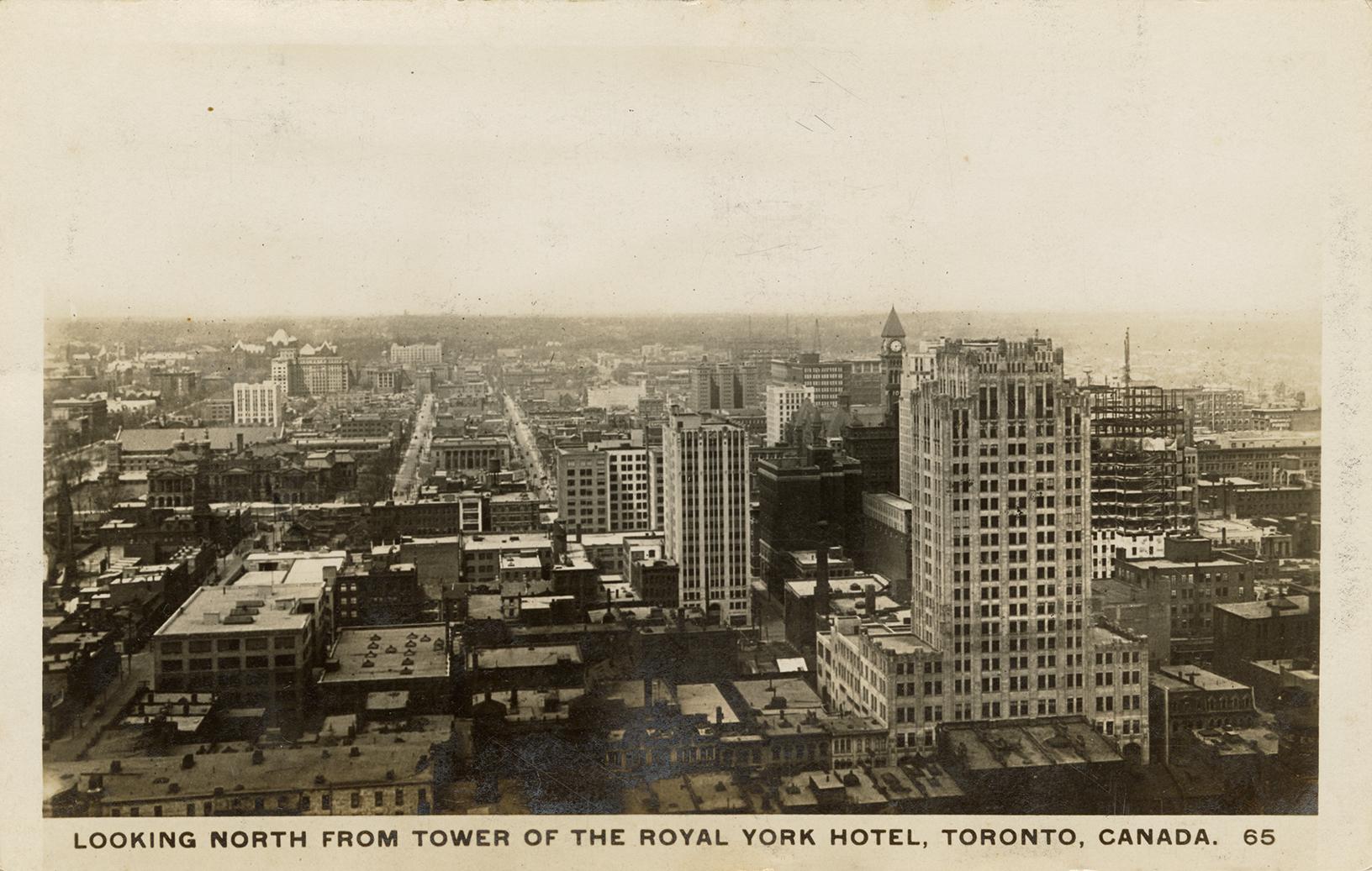 Black and white aerial photograph of a large city.