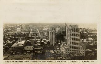 Black and white aerial photograph of a large city.