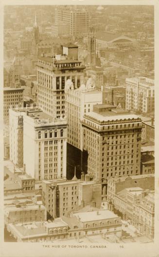 Black and white aerial photograph of skyscrapers in a large city.