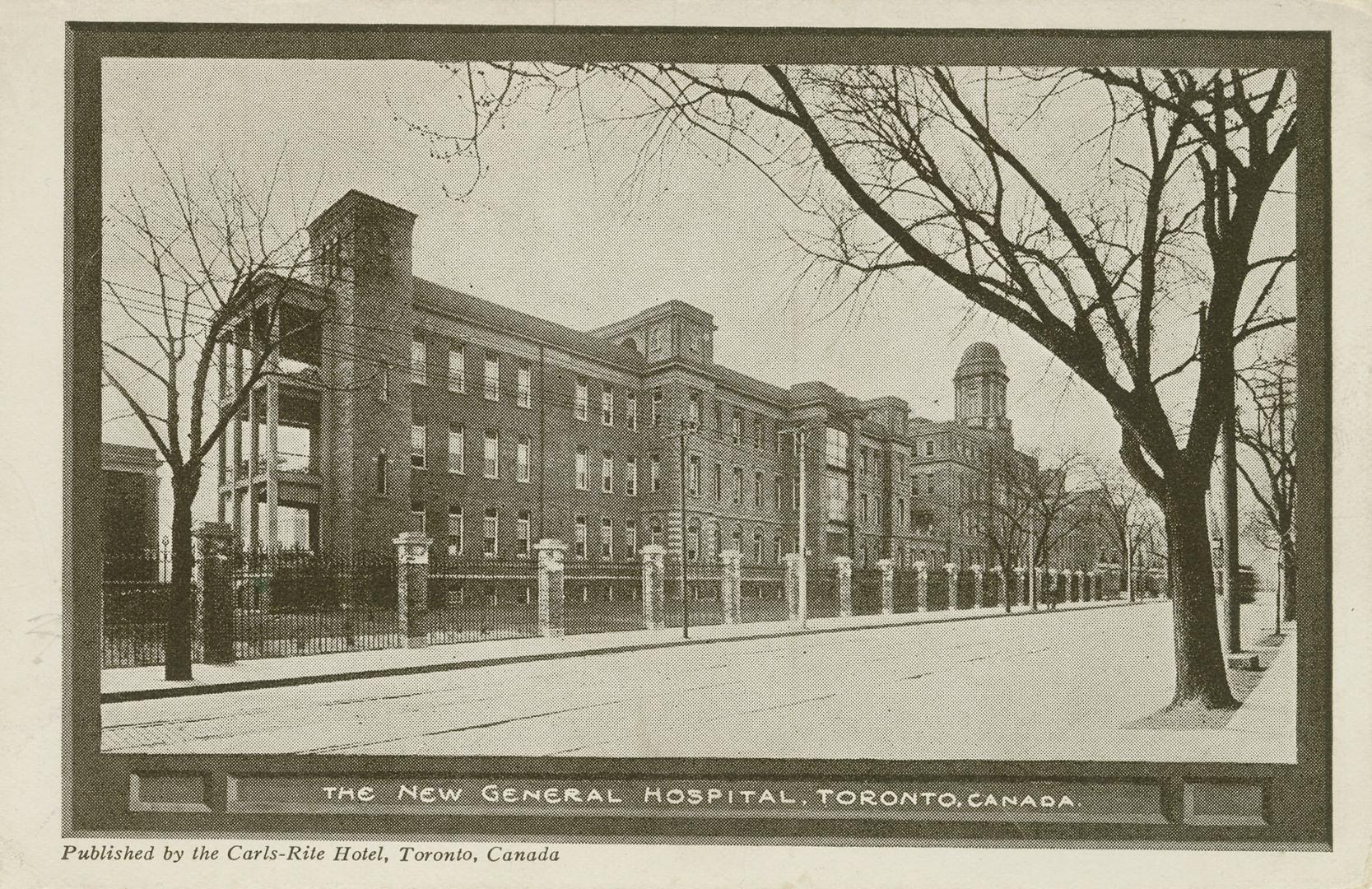 Black and white photograph of a large public building with a cupola.