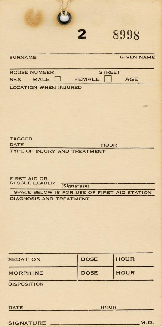 World War II air raid warden's tag to identify injuries and treatment