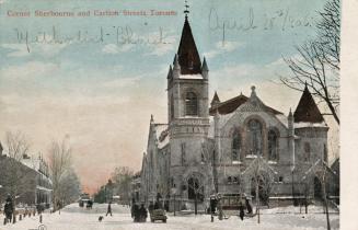 Colorized photograph of a city street in the wintertime with a huge church to the right.