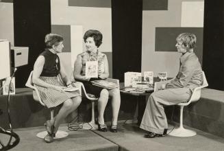 Picture of three women seated in a television studio. 