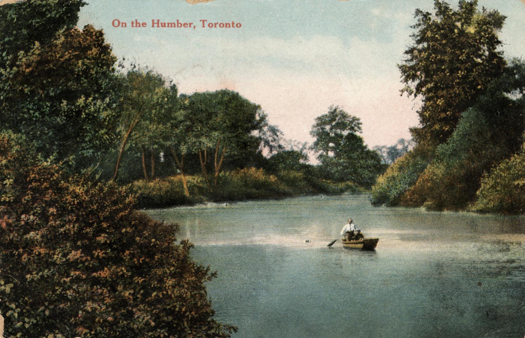 Colorized photograph of two people paddling a boat on a river in a wooded area.