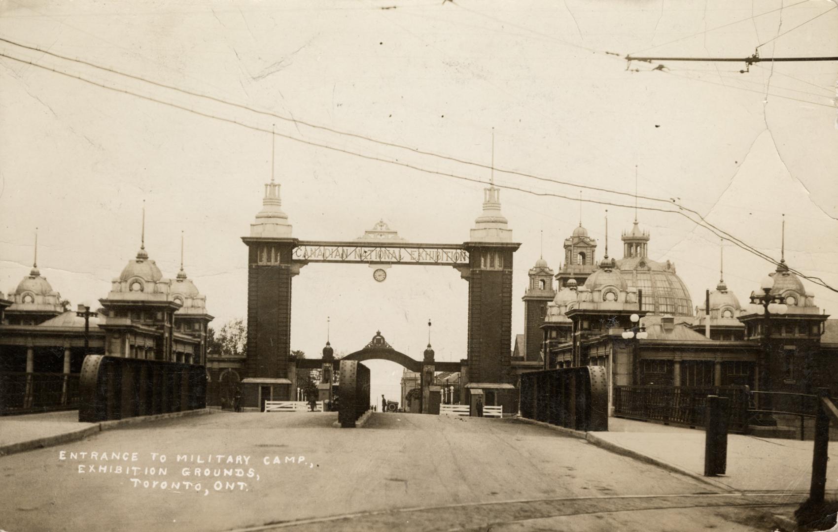 Sepia-toned photo postcard depicting the entrance of the Canadian National Exhibition Dufferin  ...