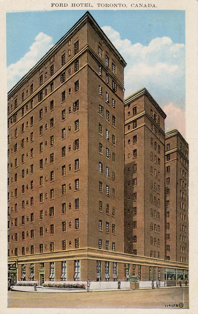 Colorized photograph of a multi story building with three towers.