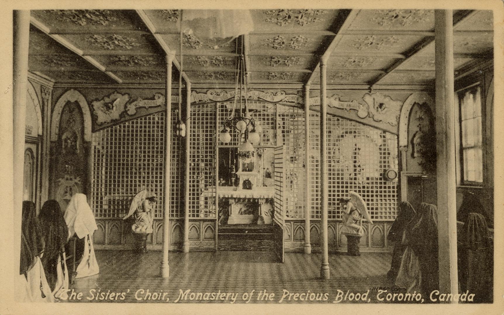 Black and photo postcard depicting a religious room with several nuns standing on the sides. Th ...