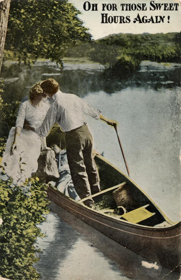 Photograph of a man with his arms around a woman in a canoe.