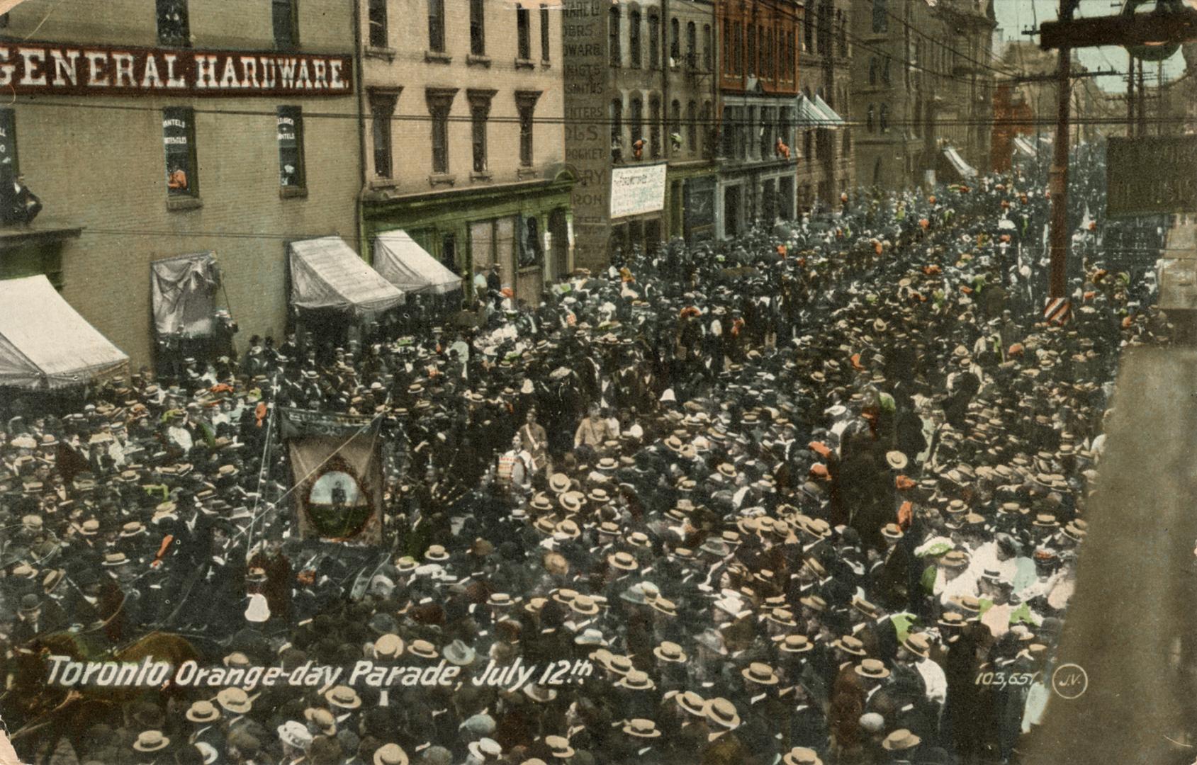 Colour postcard depicting large masses of people crowded on the streets of Toronto. A shop in t ...