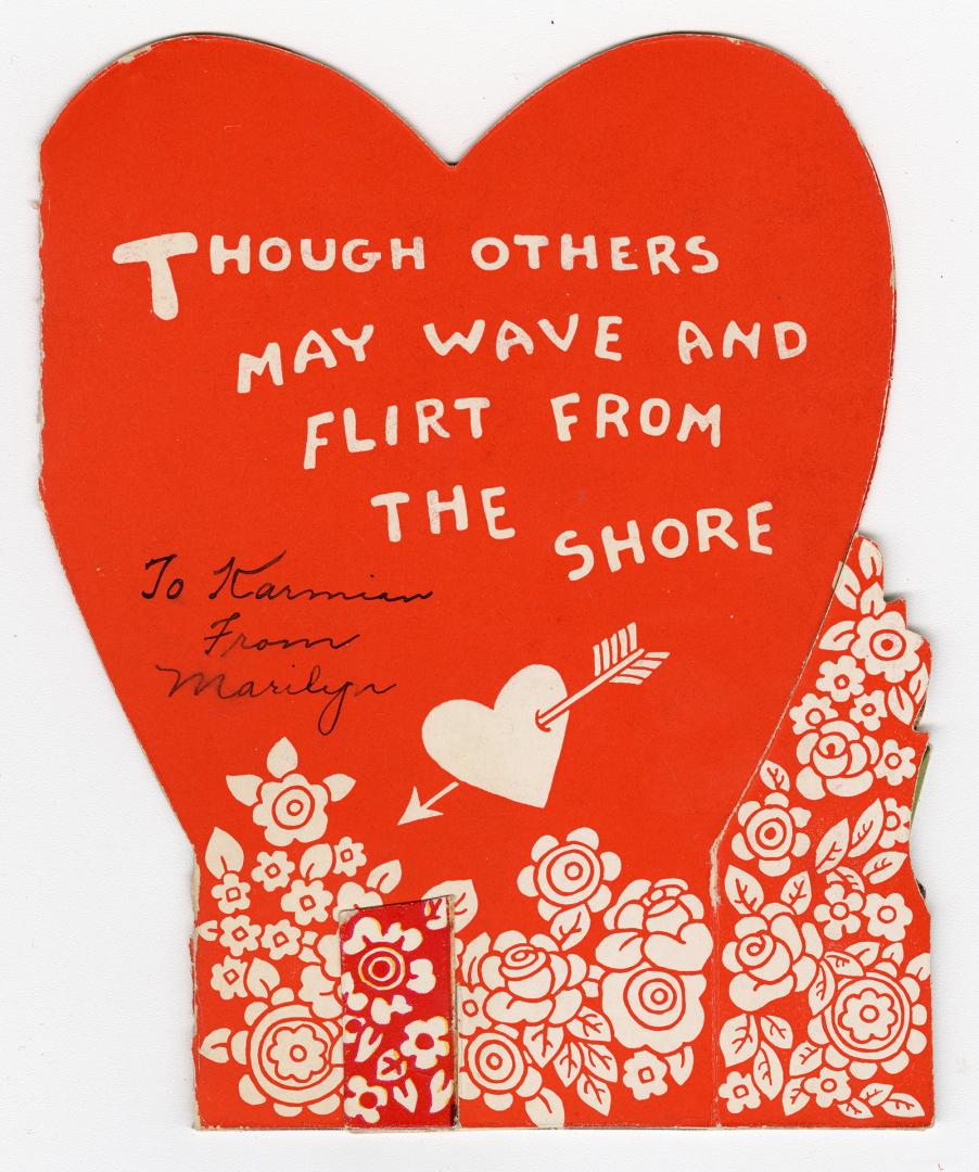 A pop-up card. Two red hearts serve as a background. A scene in the foreground shows a boat and ...