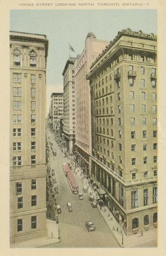 Colour postcard depicting a view of Yonge St. from above, with some buildings, retail shops, pe ...