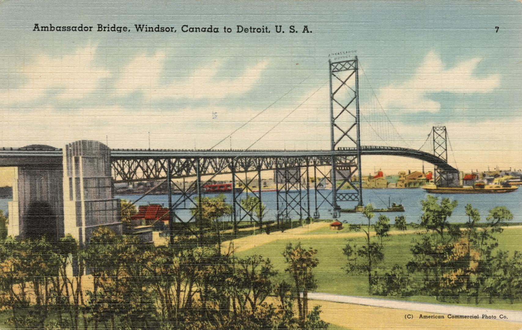 Colorized photograph of a very long expansion bridge of a river with boats running under it.