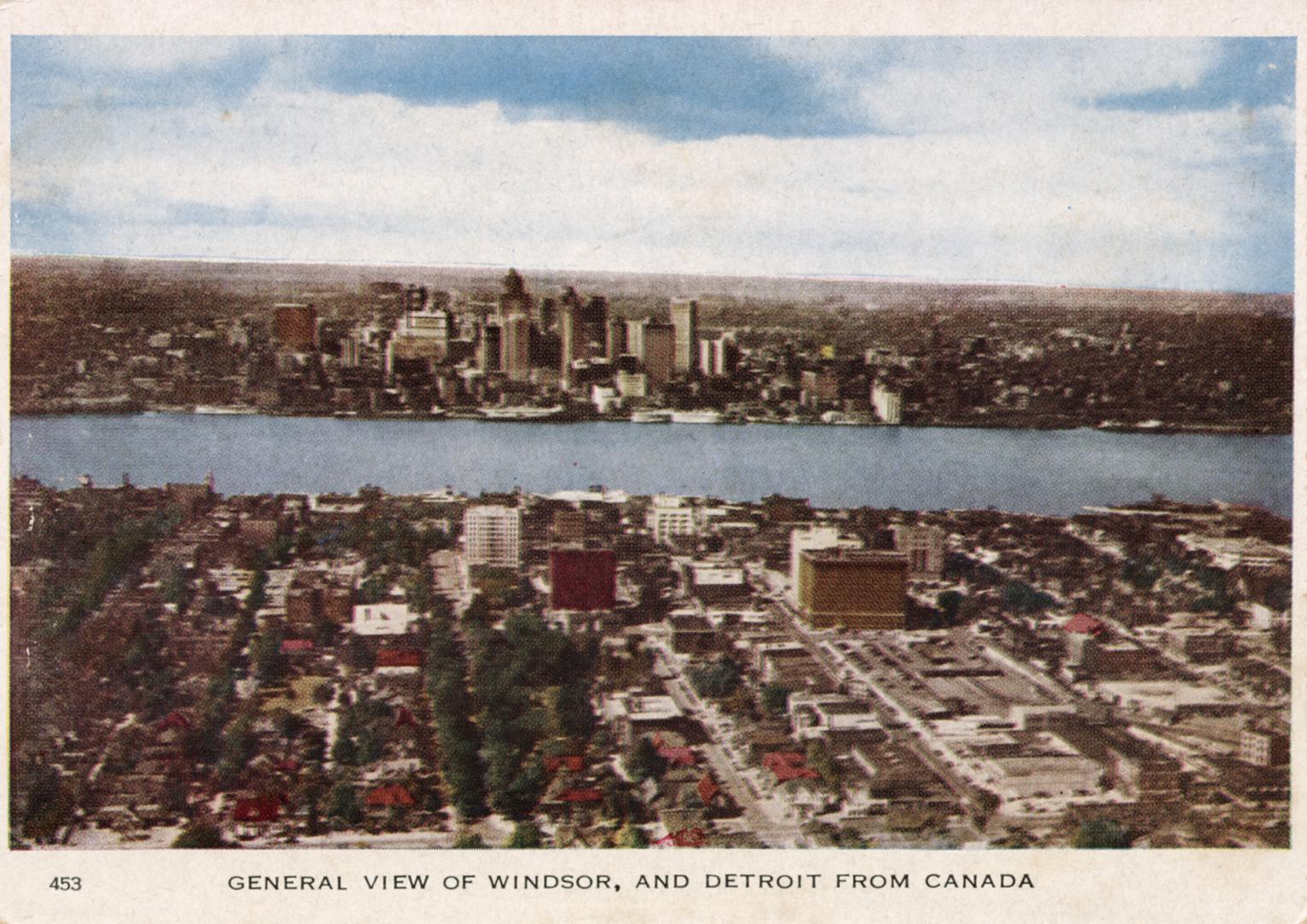 Colorized photograph of cities on both sides of a body of water.