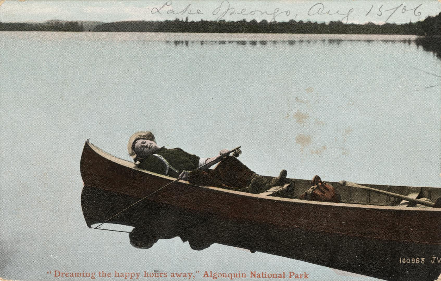 Colorized photograph of a man asleep in a drifting canoe.