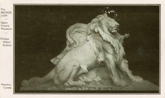 Black and white photograph of a lion sculpture facing east.