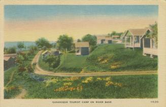 Colorized photograph of frame cabins in front of a dirt road.