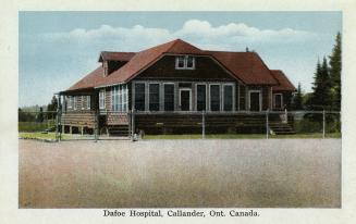 Colorized photograph of a log building with a fence around it.