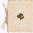 The front of the card is cream coloured. It's oval centre has parts cut out to create leaf shap…