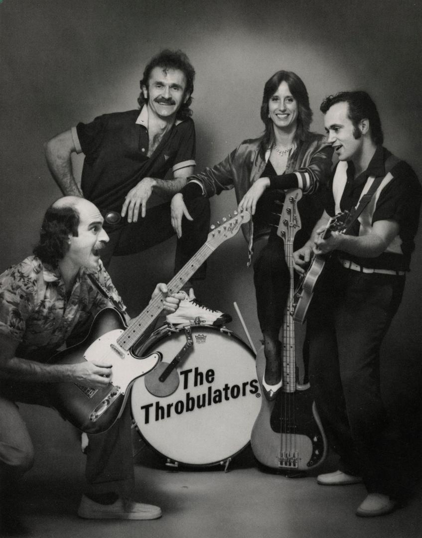3 men and 1 woman with instruments