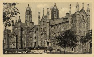 Black and white photograph of a large. gothic, collegiate building with many towers.